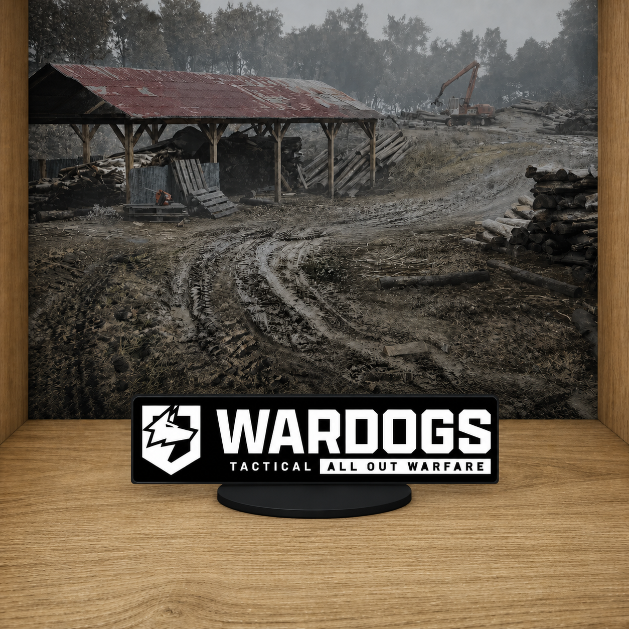 WARDOGS Full Tagline desk logo resting low on a connected black base with Valkyra mural